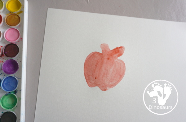 School Cookie Cutter Watercolor Painting - a super easy back to school watercolor painting with cookie cutters with school themes of pencils, scissors, crayons and apples - 3Dinosaurs.com