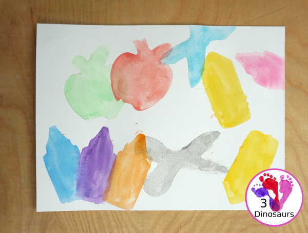 School Cookie Cutter Watercolor Painting - a super easy back to school watercolor painting with cookie cutters with school themes of pencils, scissors, crayons and apples - 3Dinosaurs.com