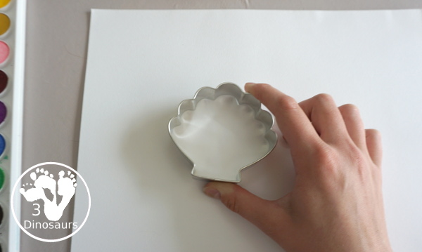 Shell Cookie Cutter Watercolor Painting for a fun beach painting theme for kids. With cookie cutters to make a fun and creative painting of shells - 3Dinosaurs.com