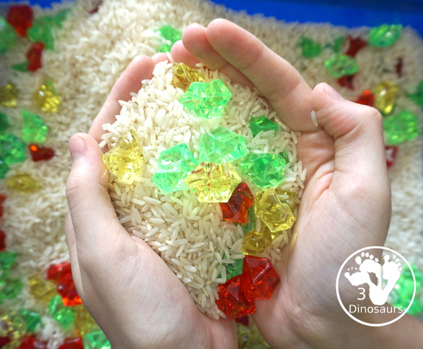 Red, Green and Yellow Sensory Bin - a simple rice and acrylic rock sensory bin with the colors of apples red, green and yellow. A simple time to setup and use. - 3Dinosaurs.com