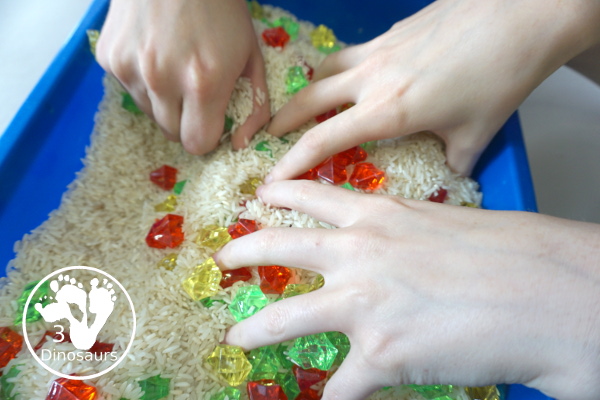 Red, Green and Yellow Sensory Bin - a simple rice and acrylic rock sensory bin with the colors of apples red, green and yellow. A simple time to setup and use. - 3Dinosaurs.com