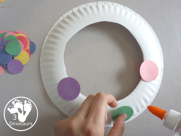 Circle Wreath Craft for Dot Day - a fun paper plate wreath with different colors of circles glued on the wreath - 3Dinosaurs.com