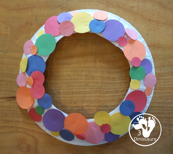 Circle Wreath Craft for Dot Day - a fun paper plate wreath with different colors of circles glued on the wreath - 3Dinosaurs.com