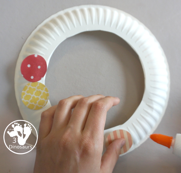 Circle Wreath with Scrapbook Paper for Kids - is a fun circle wreath craft you can make with kids for circle day. - 3Dinosaurs.com
